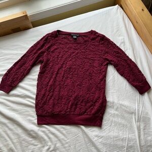75% cotton burgundy top. Lace in a roses pattern. XS